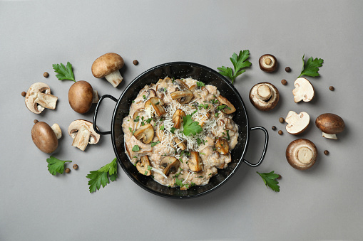 Concept of tasty food with risotto with mushrooms, top view