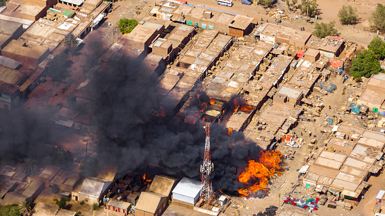 ‏An aerial photo showing the Sunnah of flames in the market of the Al-Arab neighborhood in the city of Omdurman on June 2, 2023