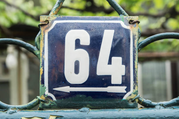 istock Weathered enameled plate of number 64 1495370912