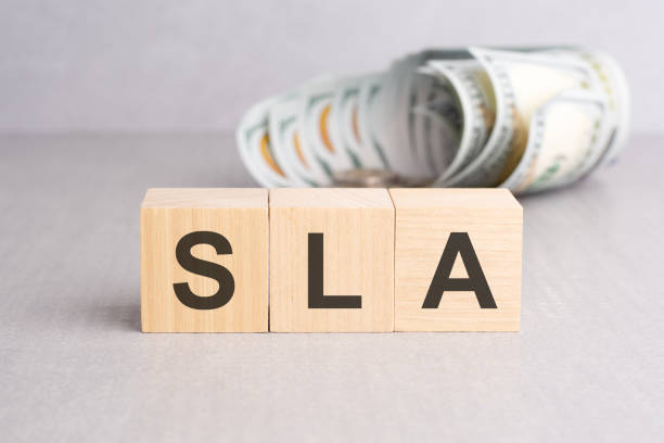 istock SLA - short for Service Level Agreement. wooden cubes with text, grey background 1495377749
