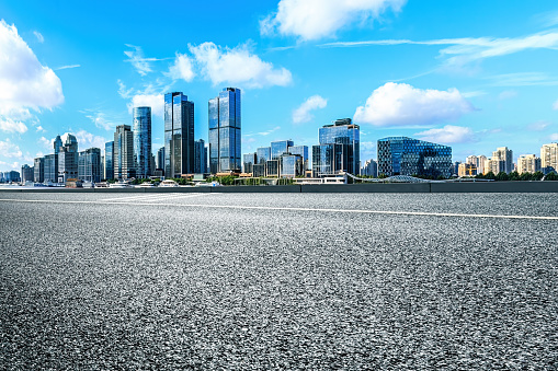 Clean asphalt road and city skyline in Shanghai. Shanghai is a first-tier city in China