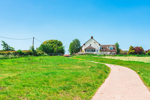 View of beautiful agricultural fields with clear blue sky in England