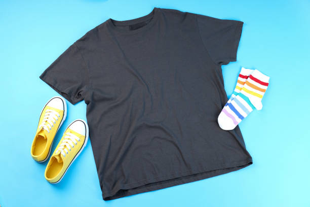 istock Blank t-shirt, sneakers and socks on blue background 1495382830