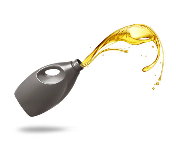 istock Splashes of engine oil pouring from a plastic  bottle isolated on white background 1495383244