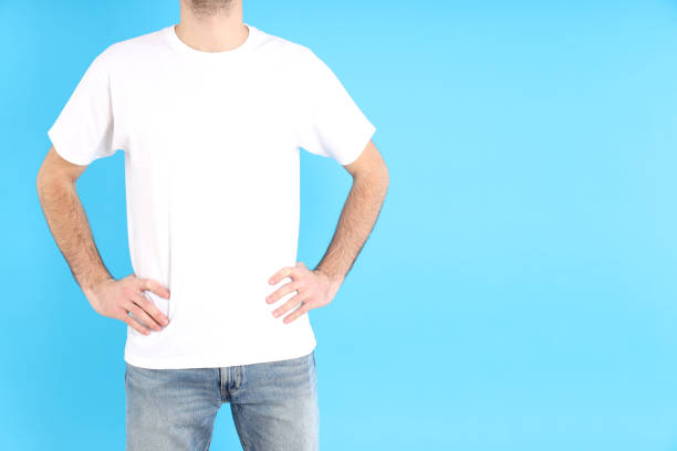 istock Man in blank white t-shirt on blue background 1495383542