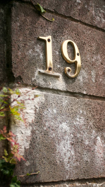 istock Metallic number 19 in a rustic entrance 1495383711