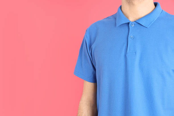 istock Man in blank blue polo on pink background 1495385242
