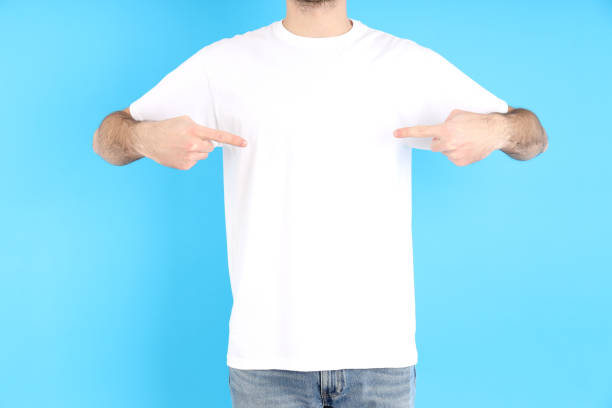 istock Man in blank white t-shirt on blue background 1495385492
