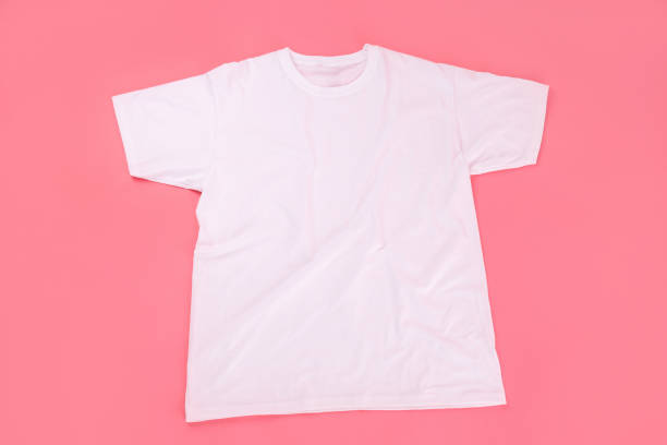 istock Blank white t-shirt with space for print on pink background 1495385516