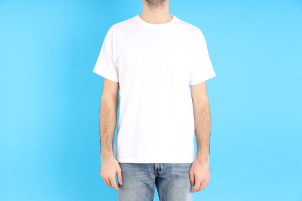 istock Man in blank white t-shirt on blue background 1495385532