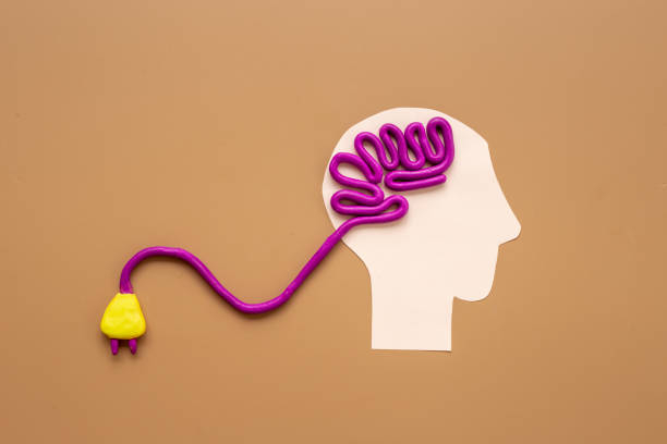 istock Brain charging and mental health and rest. Brain shape on human paper head 1495385542