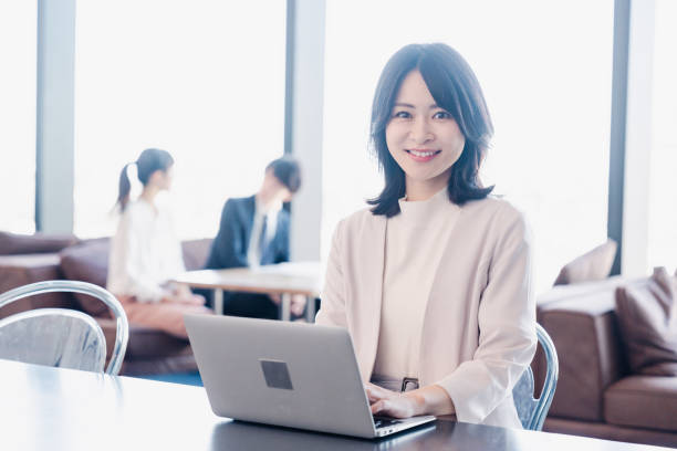 istock Businesswoman using a laptop in a shared office 1495388899