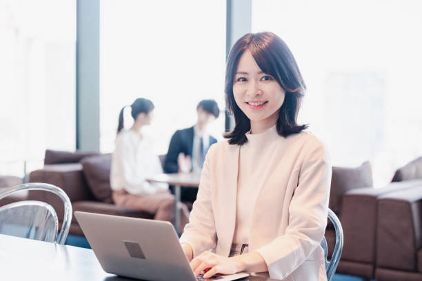 istock Businesswoman using a laptop in a shared office 1495388920