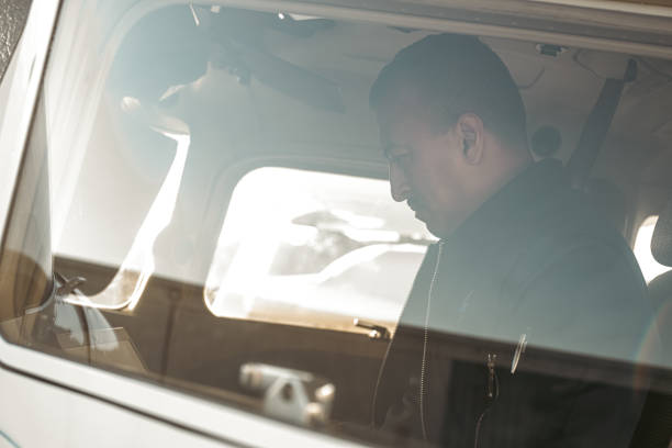 istock A pilot is sitting attentively inside the cockpit 1495390174
