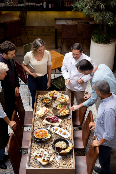 Chef presenting the menu to his staff at a restaurant