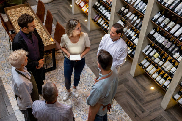 istock Business manager at a restaurant talking to her staff 1495390750