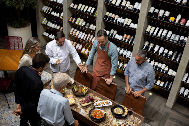 istock Chef presenting a new menu to his team at a restaurant 1495390764