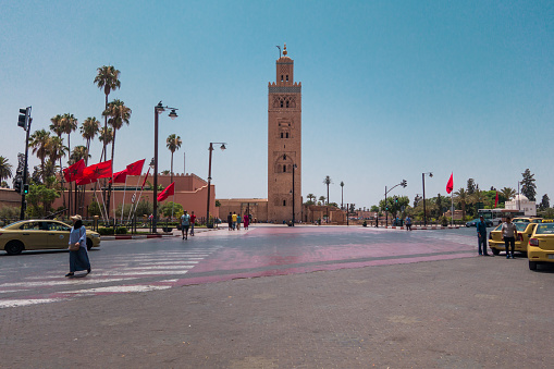 Marrakesh, Morocco - July 25th 2018 : View of Koutoubia mosque surrounded by tourists