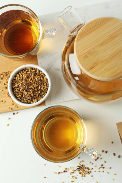 istock Concept of hot drink with buckwheat tea on white background 1495395012