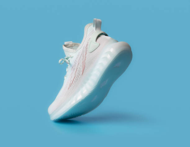 istock White sneaker on a blue background, sport shoe, sneakers 1495398148
