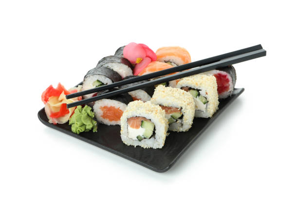 istock Plate with sushi rolls isolated on white background 1495398371