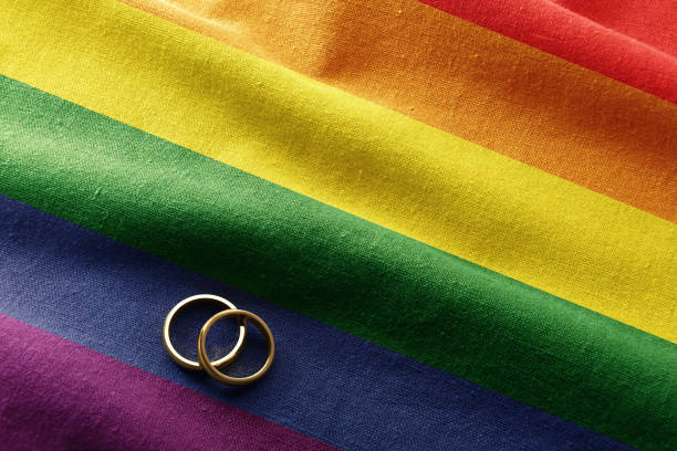 Wedding between people of the lgbt collective with rainbow flag stock photo