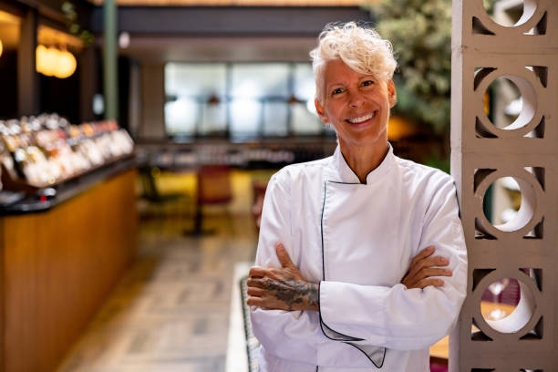 istock Happy chef working at a restaurant and smiling 1495400798