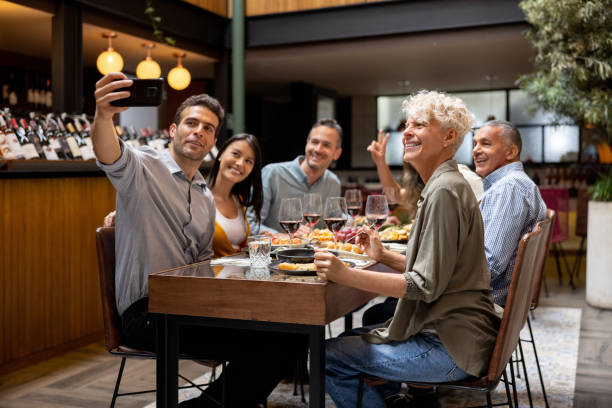 istock Friends taking a selfie at a restaurant while having dinner together 1495400877