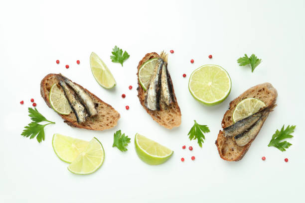 istock Delicious sandwiches with sprats on white background 1495403077
