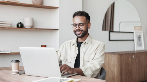 istock Young man entrepreneur working at home, distance studying 1495404185