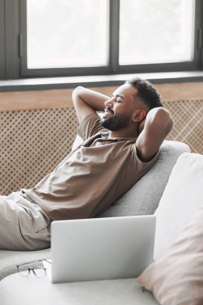 istock Relaxed young man resting at home 1495404716