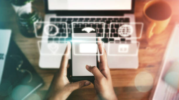 istock Technology abstract, digital hologram and hands with smartphone for networking, software and mobile app. Communication, futuristic 3d icons and mockup screen for internet, connection and social media 1495409975