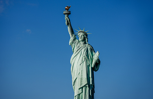 Statue of Liberty in a blue summer sky. Landmark of New York
Blue sky background with copy space