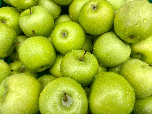 istock water drops on ripe green apples. fruit background 1495413668