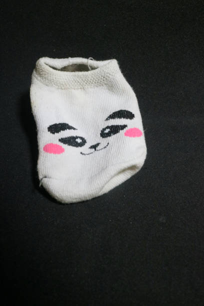istock Cute baby socks with panda faces 1495414884