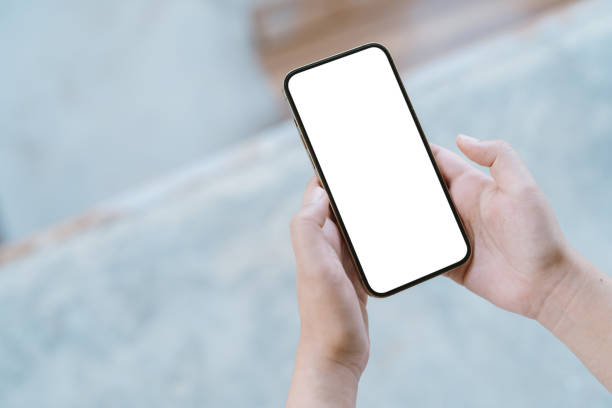 istock Women's hands holding cell telephone blank copy space screen. smartphone with blank white screen isolated. smart phone with technology concept. 1495416838