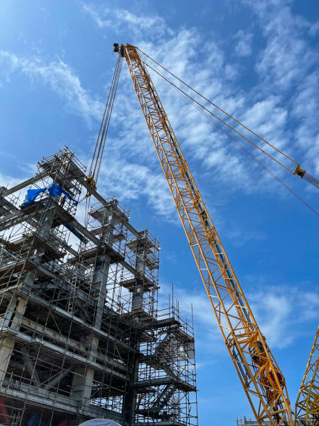 istock Crawler cranes are lifting steel beams to install, for building construction steel structures. 1495420736