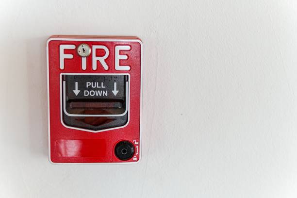 istock Fire Alarm Call Point on white concrete wall 1495420826