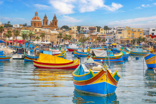 Colorful Traditional Fishing Boats in Marsaxlokk Village stock photo