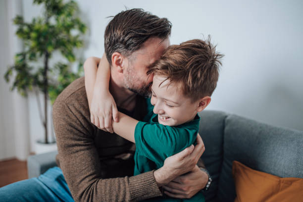 istock Father and Son Share a Heartwarming Moment on the Sofa 1495423621