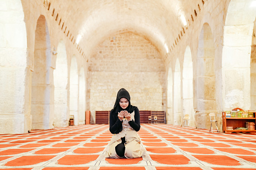 Muslims woman prayer inside of al Aqsa mosque