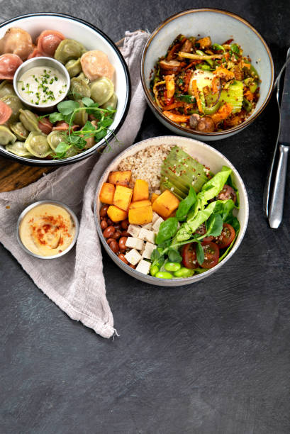 istock Vegetarian and various vegan dishes on dark table. 1495427539
