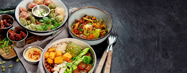istock Vegetarian and various vegan dishes on dark table. 1495427548