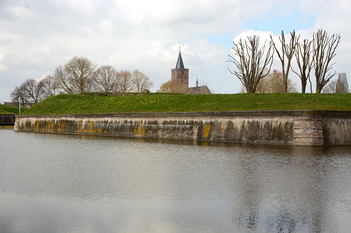 North Holland city of Naarden. Fortified wall with in front a Moat.