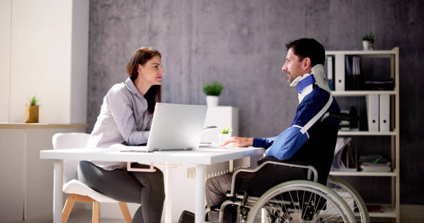Accident Disability Claims Attorney Or Lawyer Accident Disability Claims Attorney Or Lawyer And Injured Client personal injury lawyer stock pictures, royalty-free photos & images