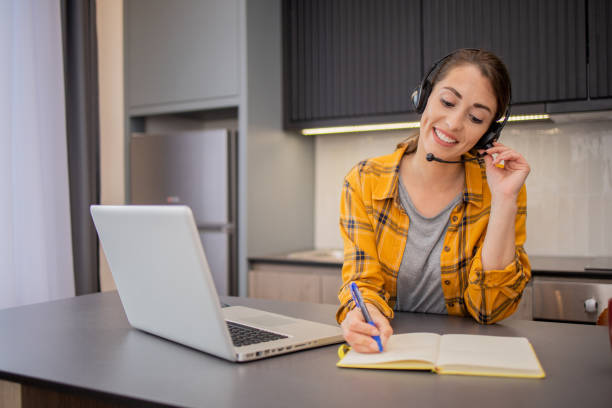 istock Young woman is studying from home 1495430716