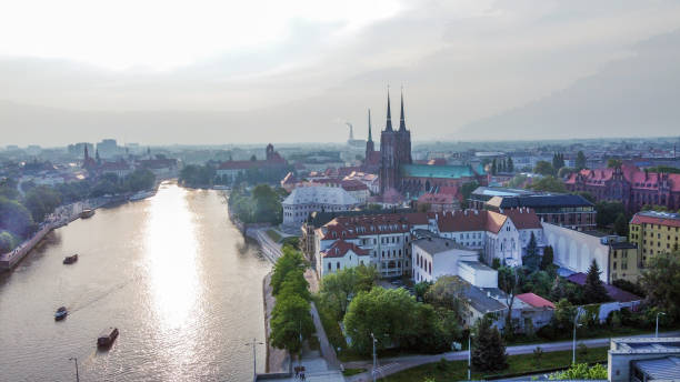 istock Aerial view of Wroclaw with  Cathedral of St.John the Baptist (two towers) and Oder river 1495431871