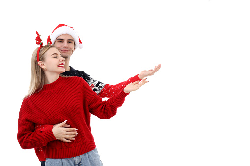 Couple in Christmas clothes isolated on white background