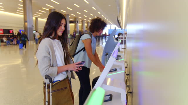 Young Women Travelers in an Airport