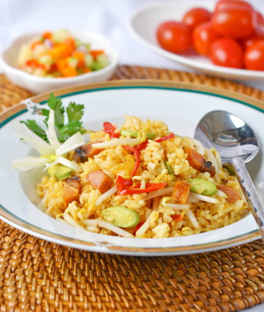 istock A popular Indonesian specialty is Fried Rice (Nasi Goreng). Fried rice can be added with various ingredients such as meat, chicken, fish, seafood and vegetables 1495433332